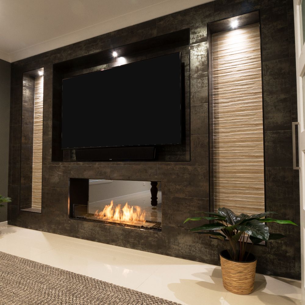 Flex 18DB Modern living room with a stone wall featuring a television and built-in fireplace.