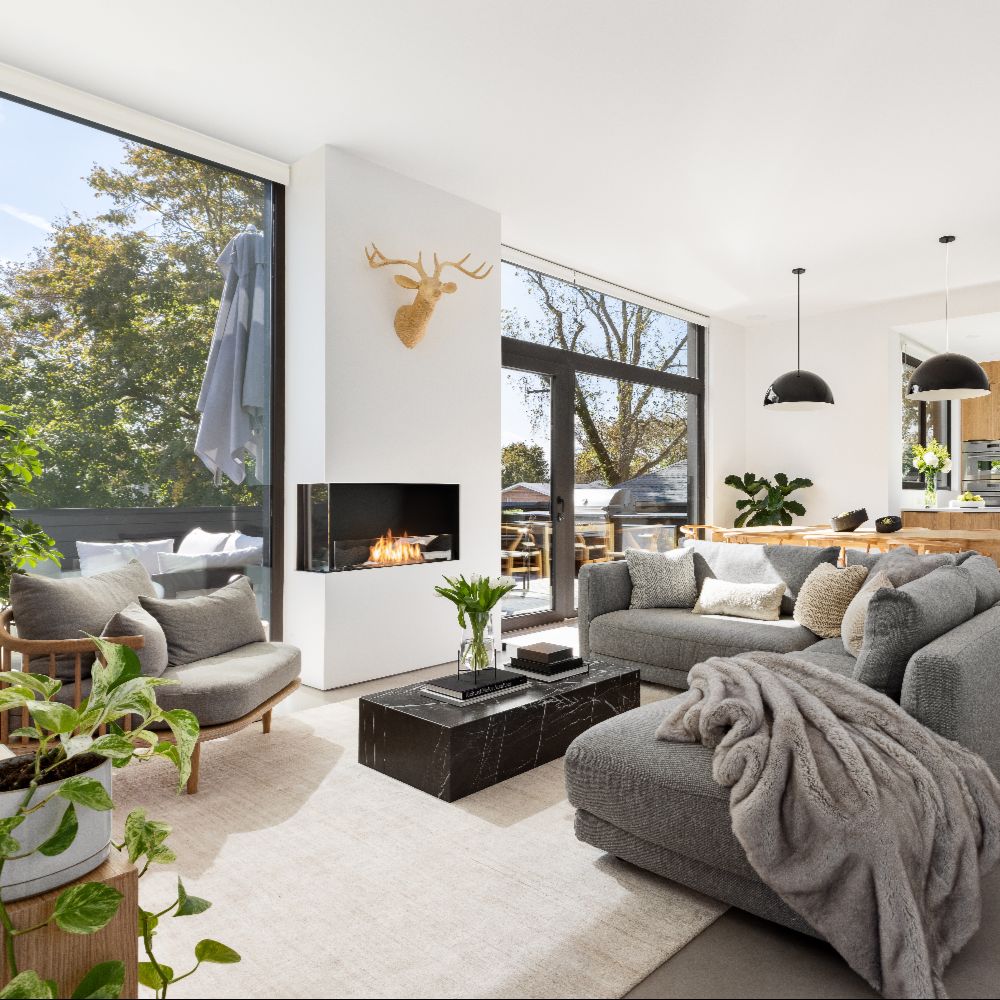 Flex 18LC Modern living room with gray sofa, coffee table, and decorative elements.