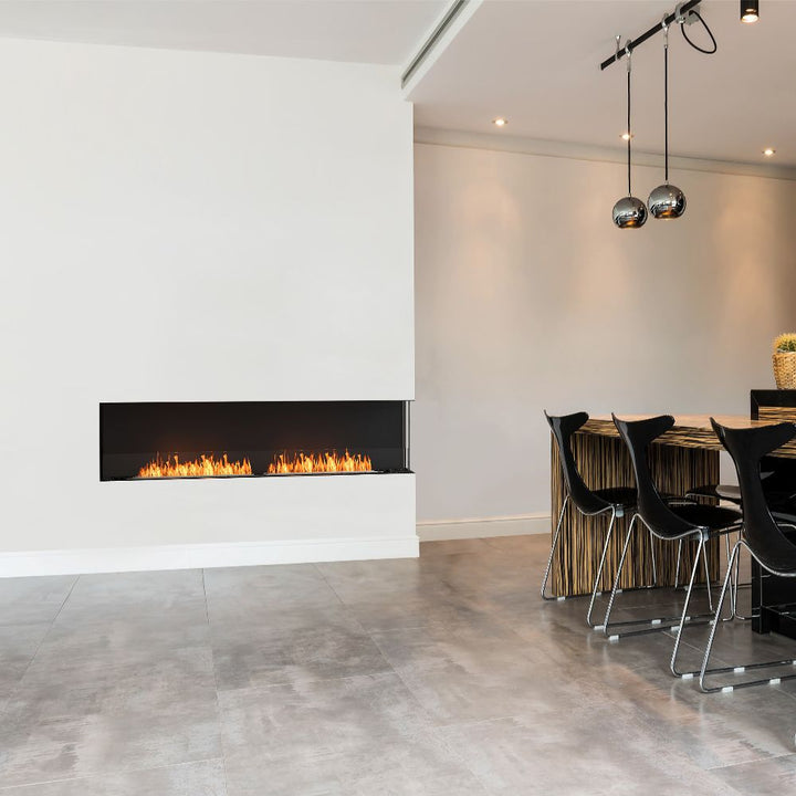 Flex 18RC Modern living room with a white fireplace and a dining table with chairs.